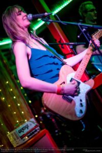 Maryjo-Mattea-playing-guitar